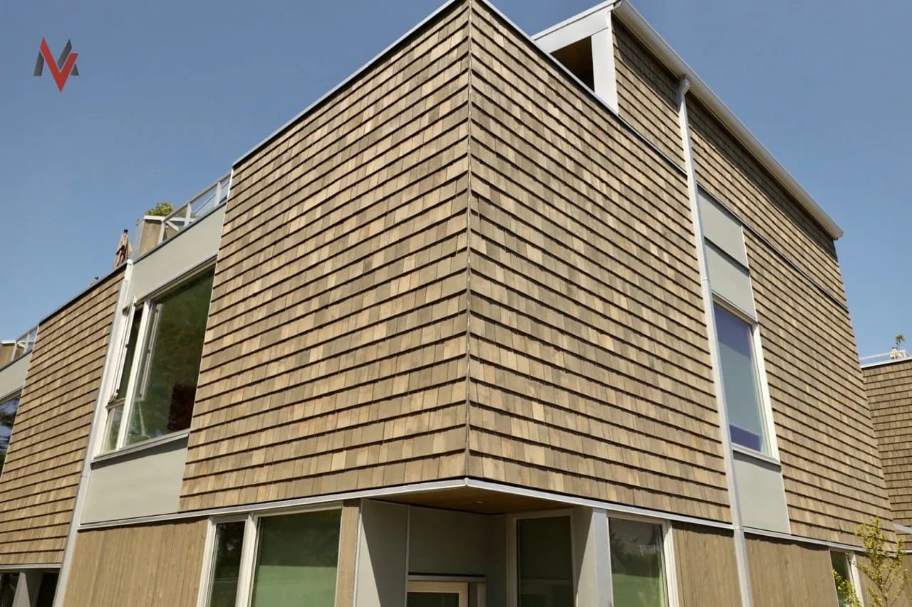 Cedar shingle exterior on a North Vancouver multi-family — heritage-style cladding