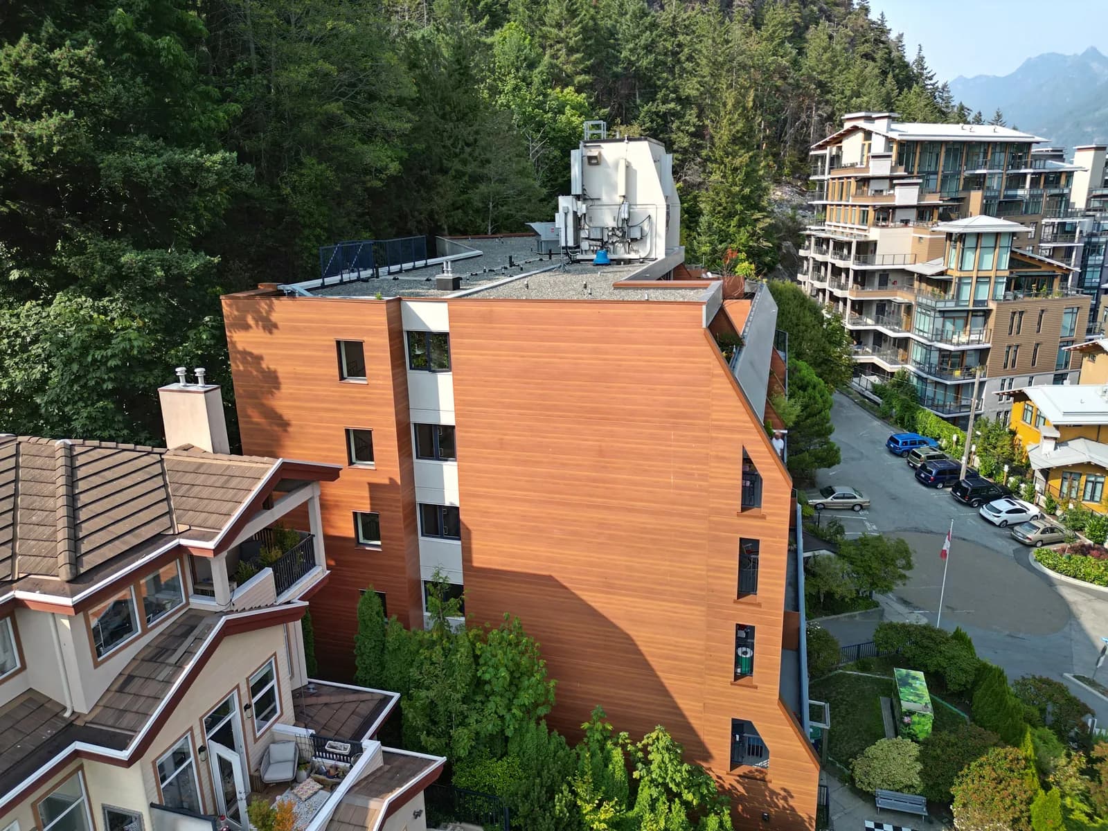 Multi-family coastal building with longboard cladding installed over rainscreen — rainscreen retrofit Vancouver result